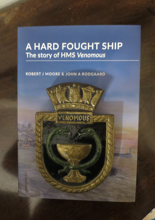 Crest of HMS Venomous on top of book cover