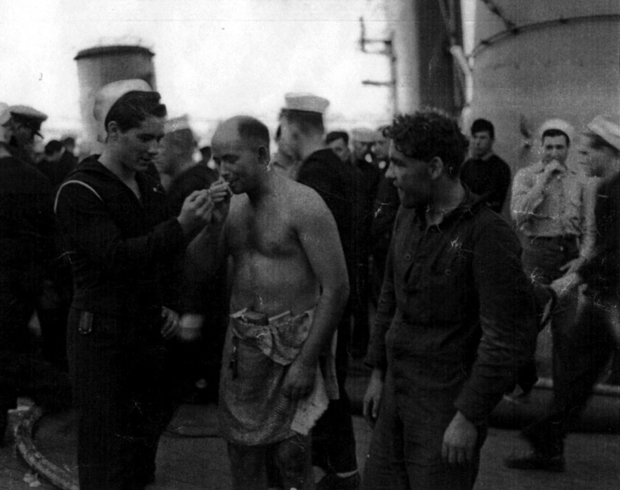 Stoker 1st Class Sesrle W Badman on the deck of USS Augusta at Casablanca on 13 November 1942